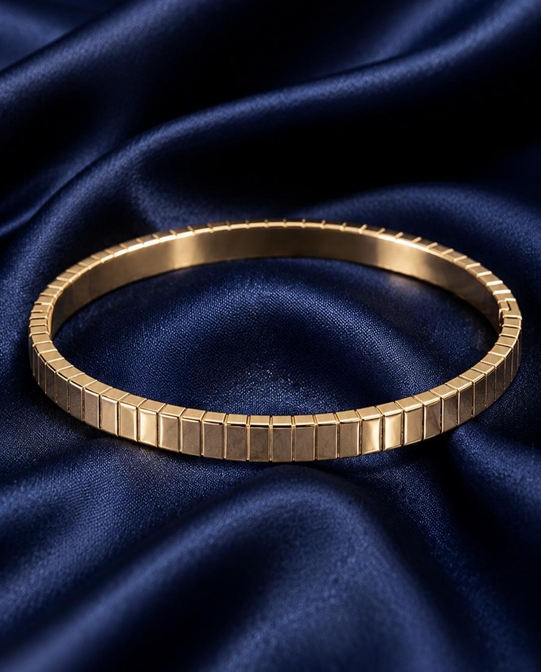 A Textured Geometric Gold Bangle Bracelet. A gold-toned bracelet featuring a series of uniform, rectangular vertical links arranged in a continuous, flexible band. 18K Gold Plated Stainless Steel Cuff | Perfect Gift for girlfriend, Birthday. Anniversary, Bridesmaid. Waterproof and Tarnish resistant jewelry.