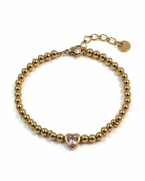 A Gold Plated Beaded Bracelet with a Pink CZ Heart stone . Stainless steel adjustable  bracelet